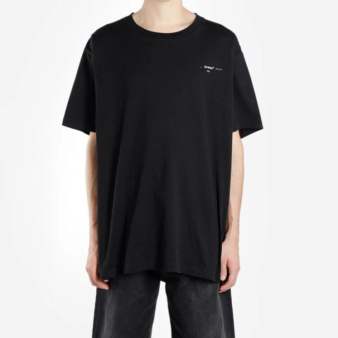 Oversize-T-skjorte med malingssprut-piltrykk, bomull, rund hals, korte ermer, løs passform, svart