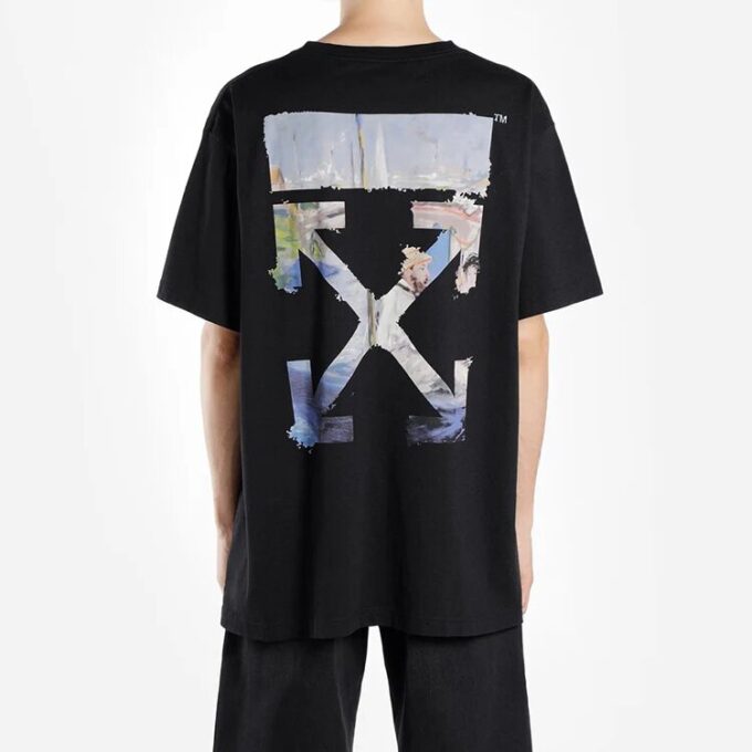 Oversize-T-skjorte med malingssprut-piltrykk, bomull, rund hals, korte ermer, løs passform, svart