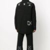 Oversized skjorte med rutete lommer og knapper